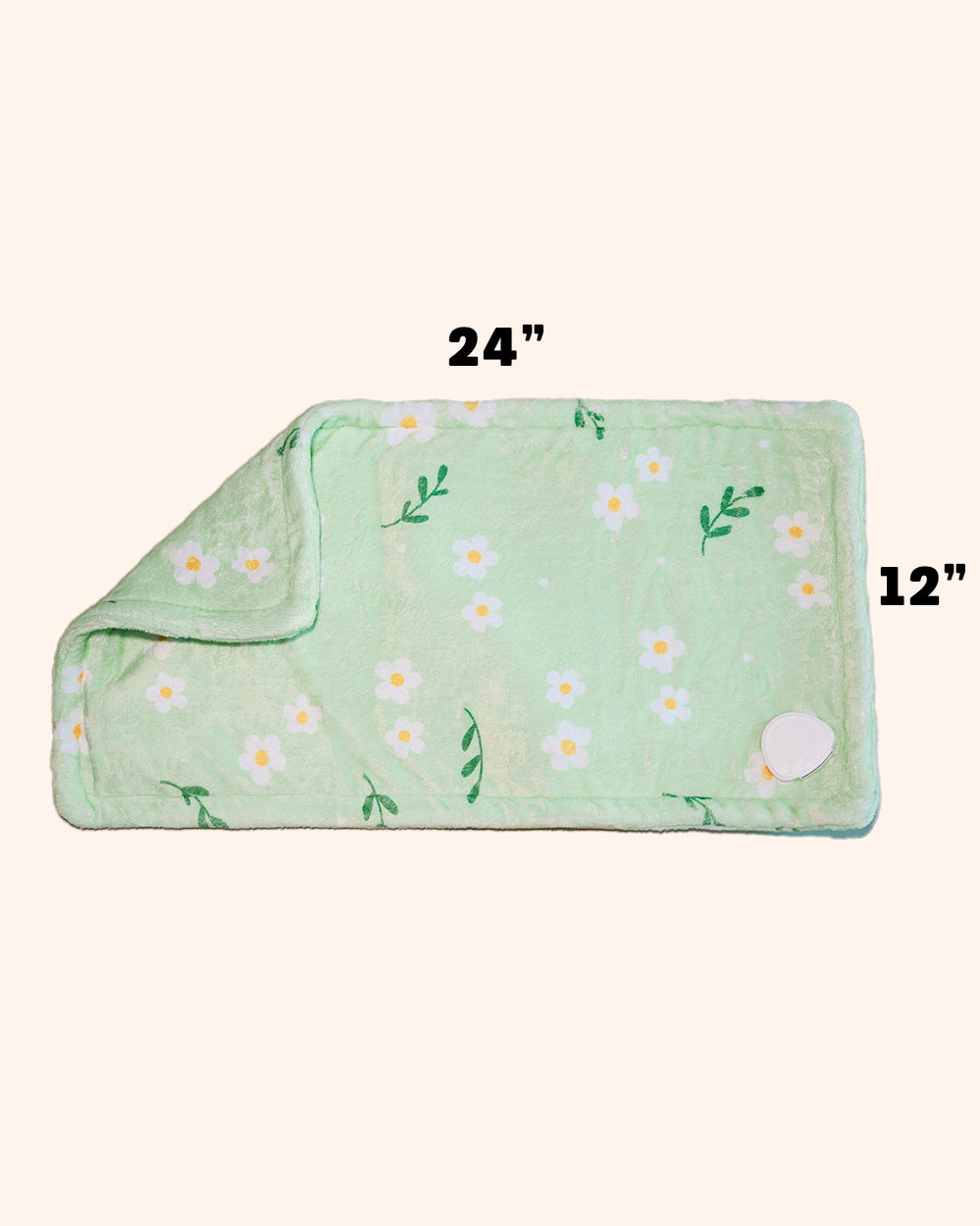Green heating pad with floral pattern and measurements on a white background.